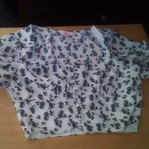 White crop top with black floral designs
